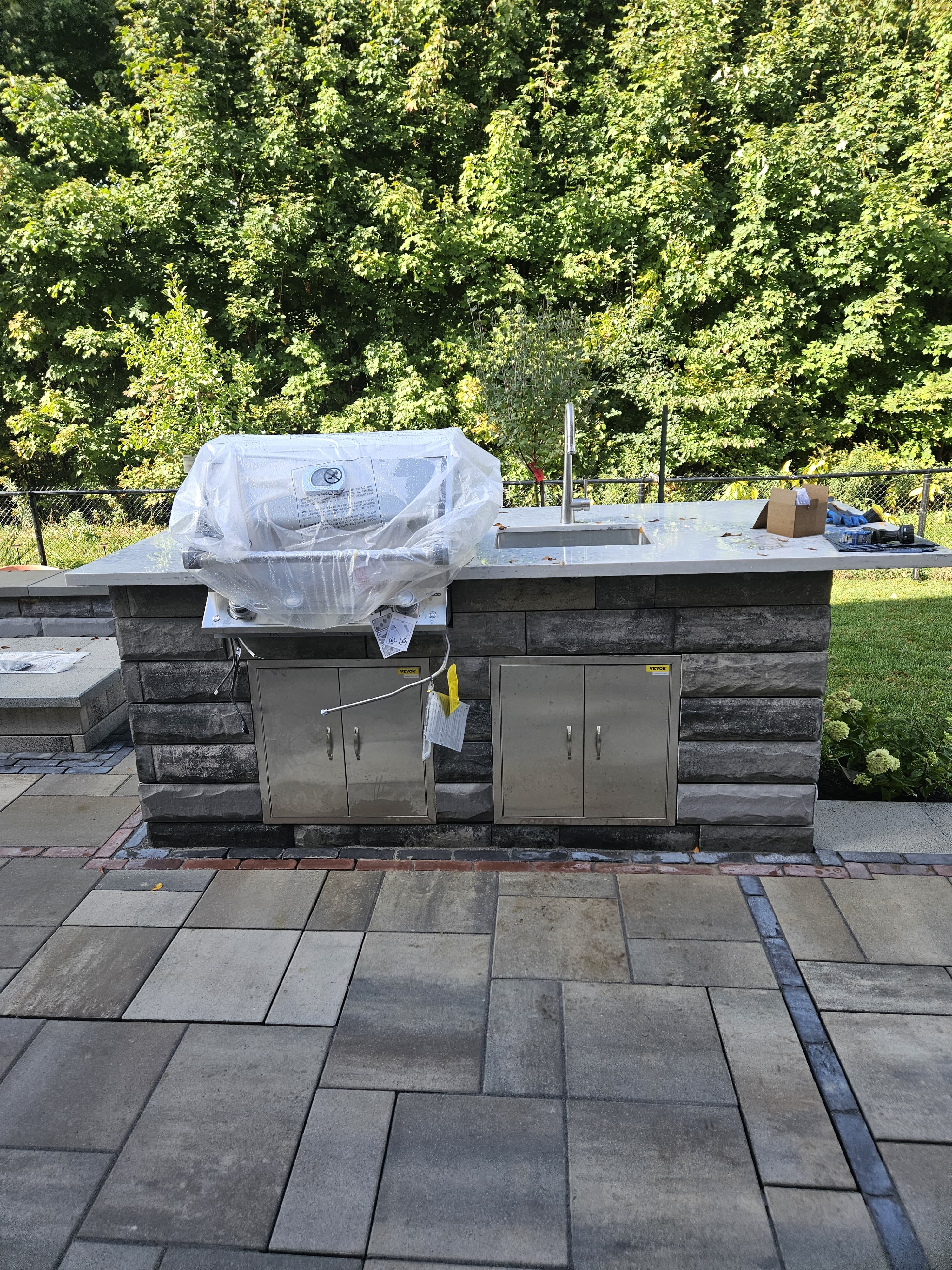 Outdoor kitchen on stone patio